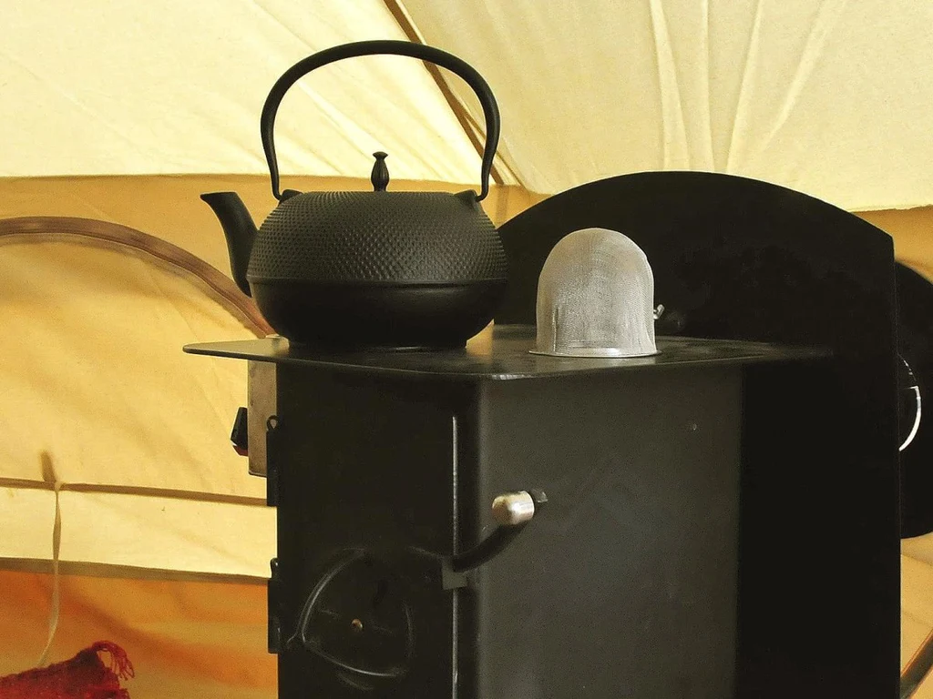 What are the benefits of using a kettle on a wood burner
